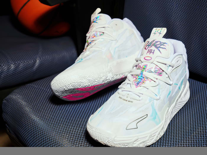 LaMelo Ball's white and blue PUMA sneakers.